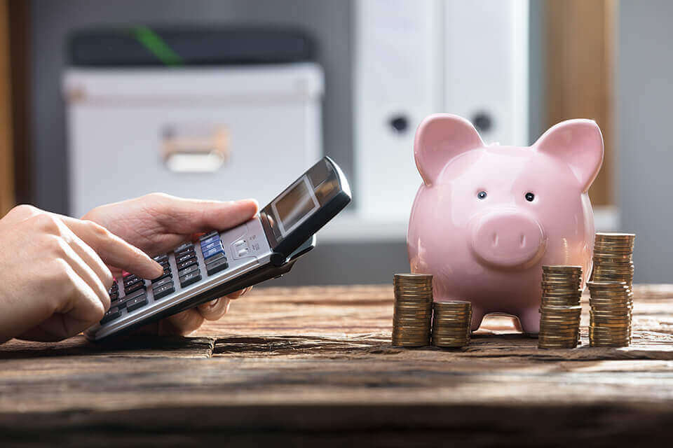 piggy bank and a calculator