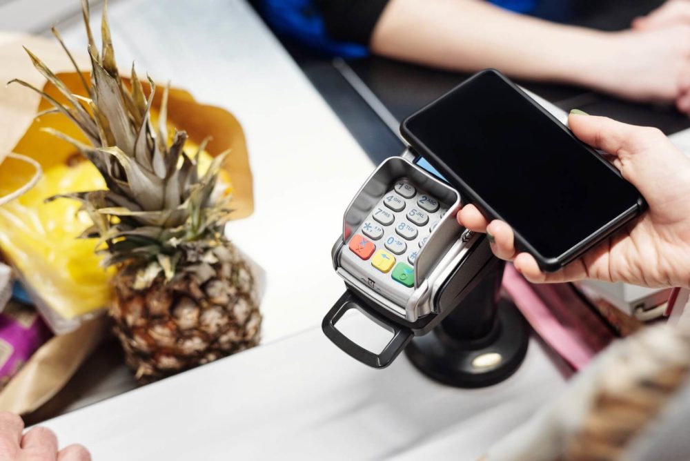 A person paying with their smartphone