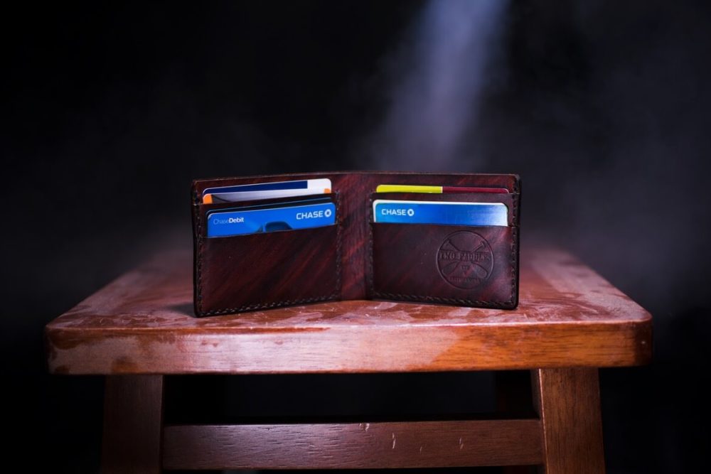 brown wallet with credit cards