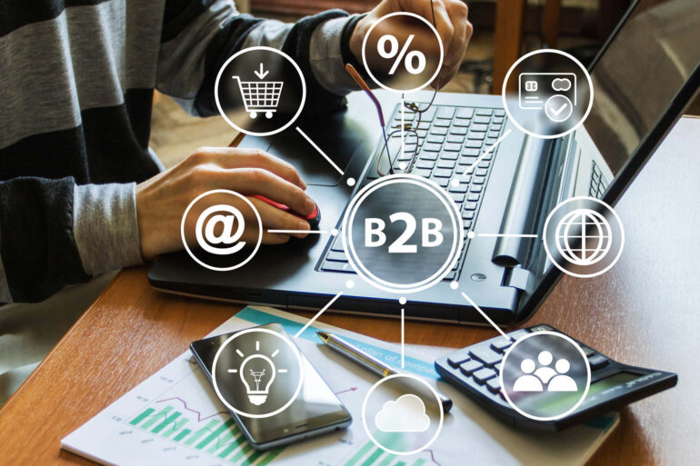 A B2B scheme overlaying a person working on a laptop