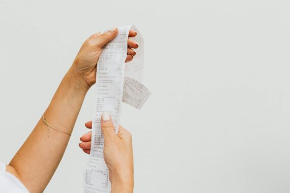 A woman holding a receipt